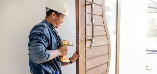 Contractor for Schneider Construction installing new entry door for a home in Central Illinois