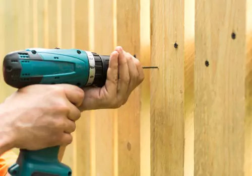 A residential contractor installing new Fencing in Peoria IL