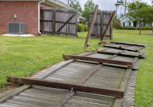 Fencing that has fallen down after a severe storm, needing fencing repair in Peoria IL