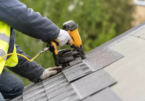 Contractor installing new Roofing on a home in Peoria IL