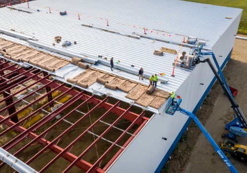 Schneider Construction installing new Flat and Metal Roofs for a local business in Peoria IL