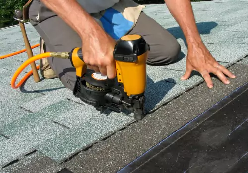 A roofer is seen on a job site. Schneider Construction is one of the best roofing companies in Peoria IL.